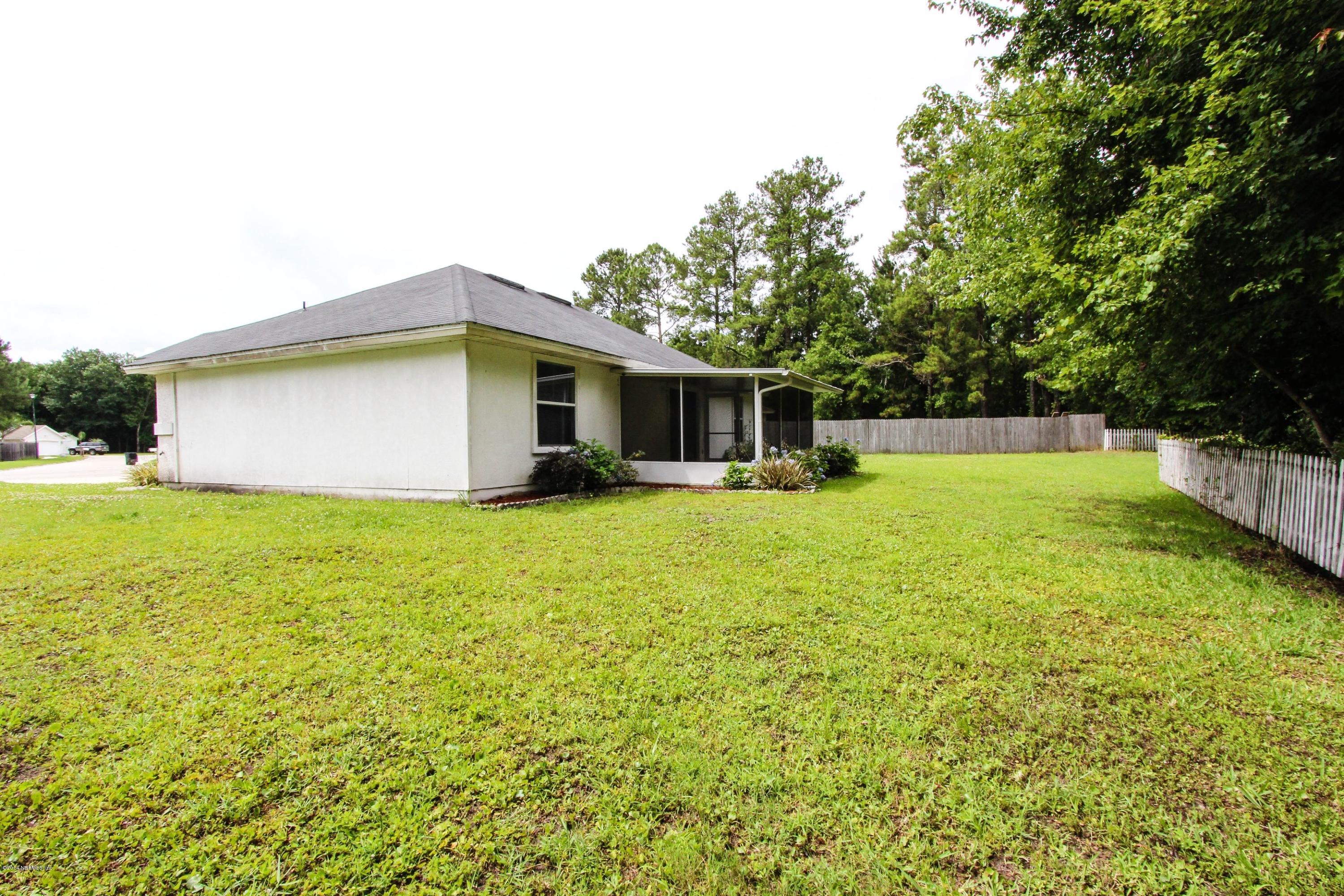 2750 Archer Street Middleburg, FL 32068 - Photo 34 of 34 a view of a house with a yard