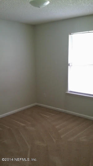 2750 Archer Street Middleburg, FL 32068 - Photo 9 of 34 an empty room with a window
