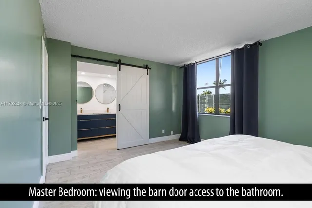 a bedroom with a bed and a mirror