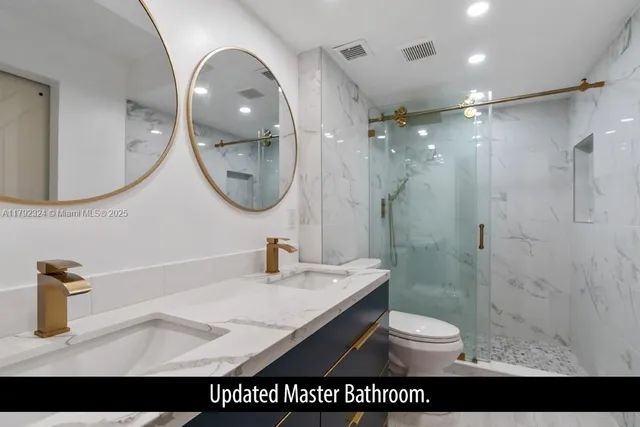 a bathroom with a sink a shower and a mirror