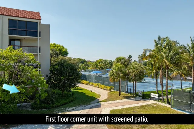 a view of a swimming pool with a yard