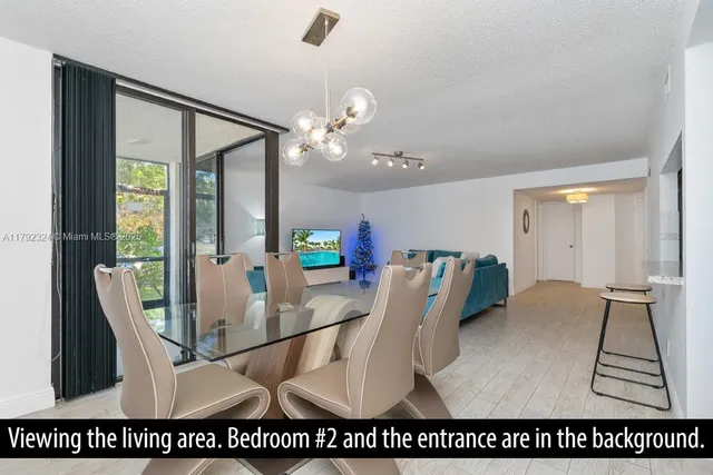 a living room with a bed furniture and a window