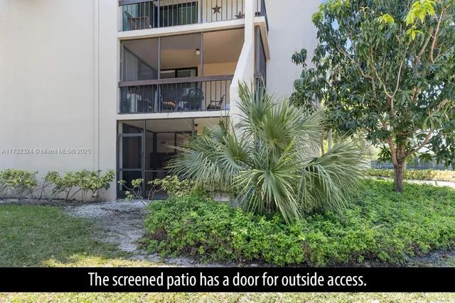 a view of outdoor space with garden and seating area