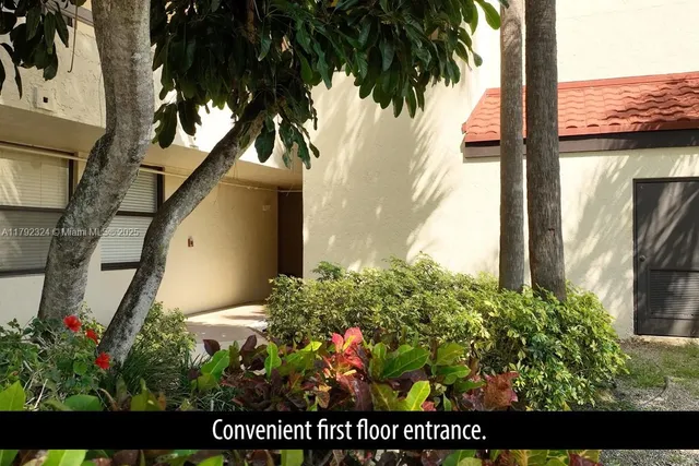 a view of a house with a tree