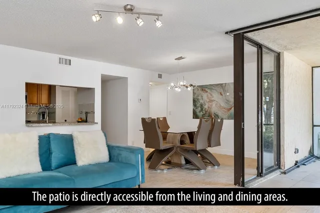 a view of kitchen with furniture and a chandelier
