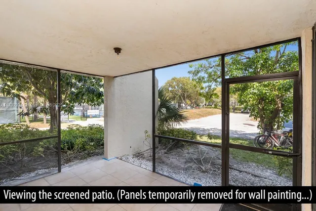 a view of a room with a large window