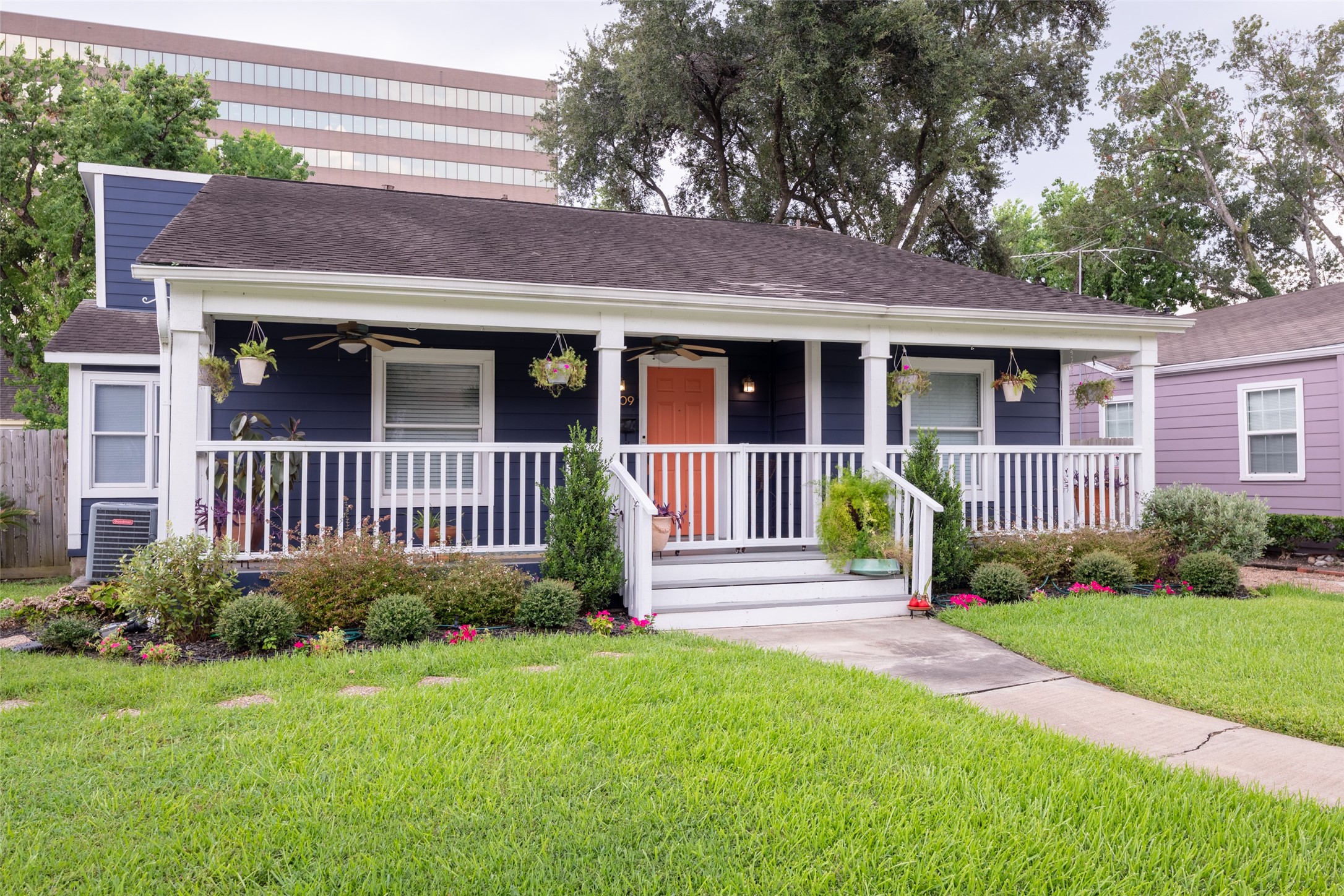 a view of a house with a yard and plants