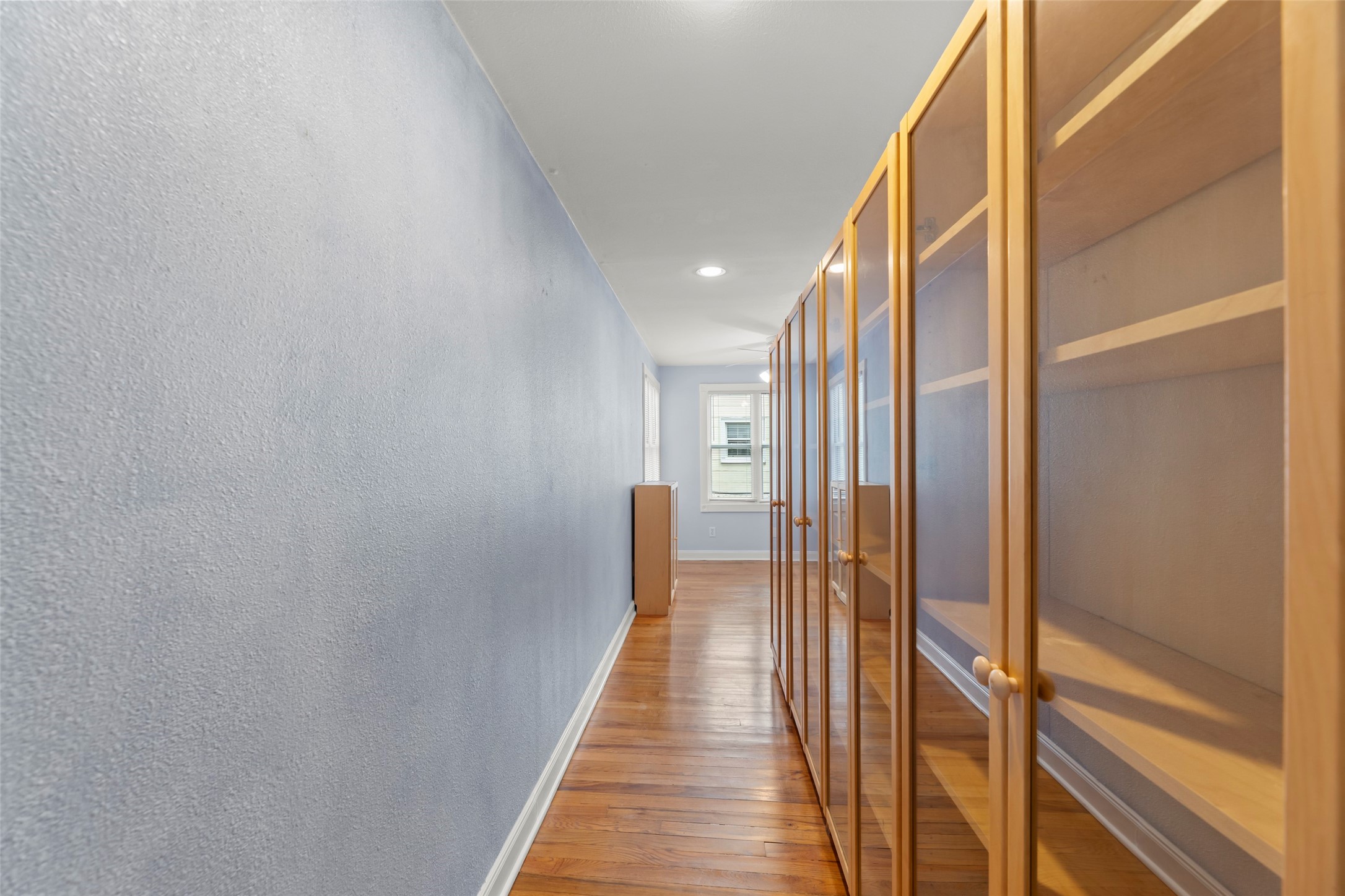 2209 Portsmouth Street Houston, TX 77098 - Photo 12 of 28 a view of a hallway with wooden floor and staircase