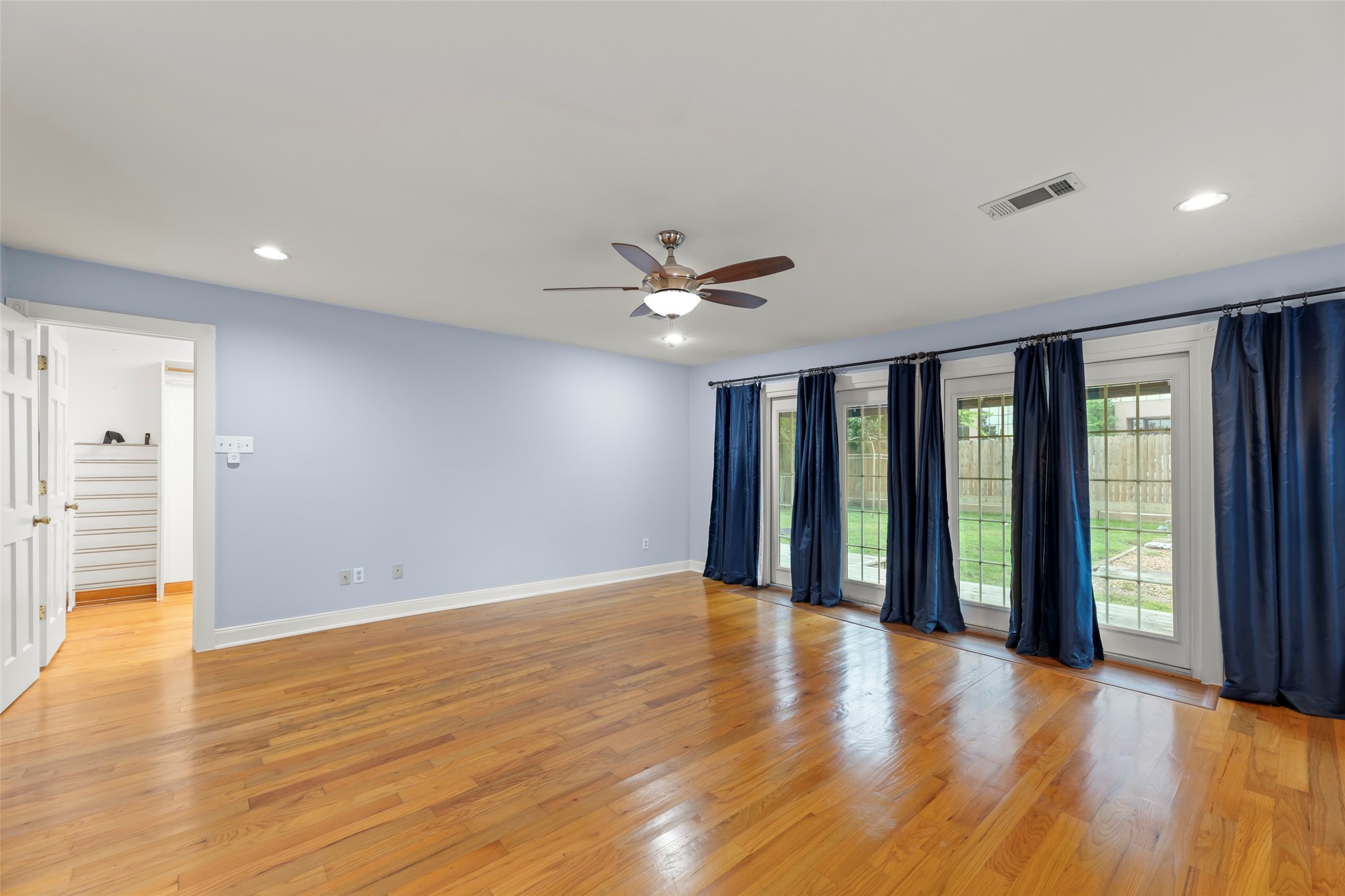 2209 Portsmouth Street Houston, TX 77098 - Photo 14 of 28 a view of an empty room with wooden floor and a window