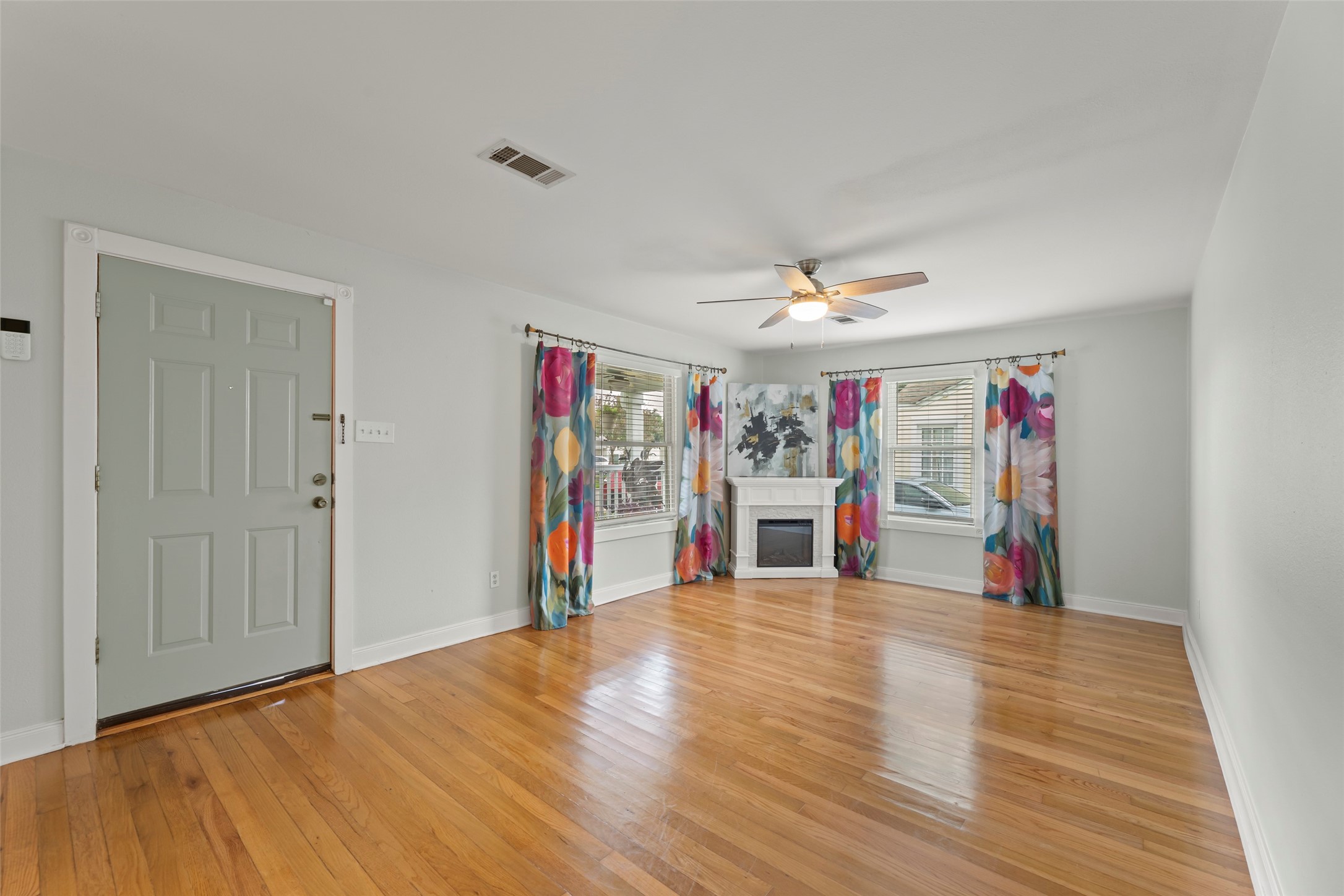 2209 Portsmouth Street Houston, TX 77098 - Photo 4 of 28 a view of a livingroom with wooden floor and stairs