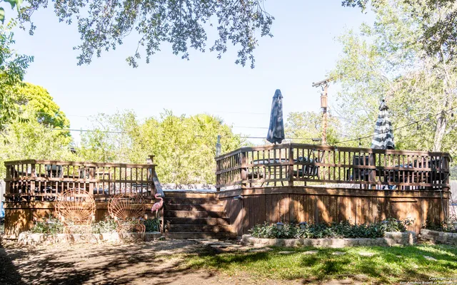 a view of a lake with boats and palm trees