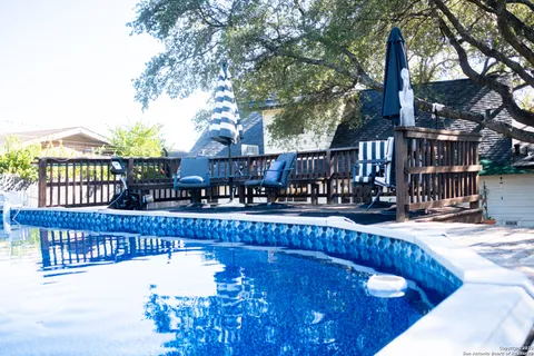 a view of a swimming pool with a patio