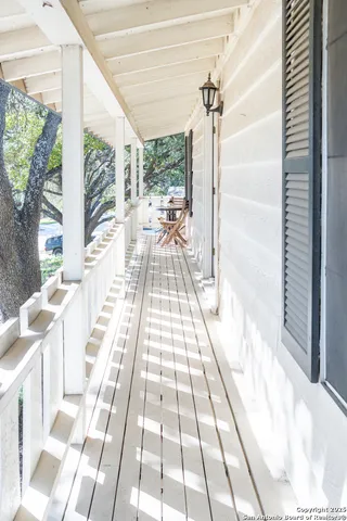 a view of a balcony with wooden floor