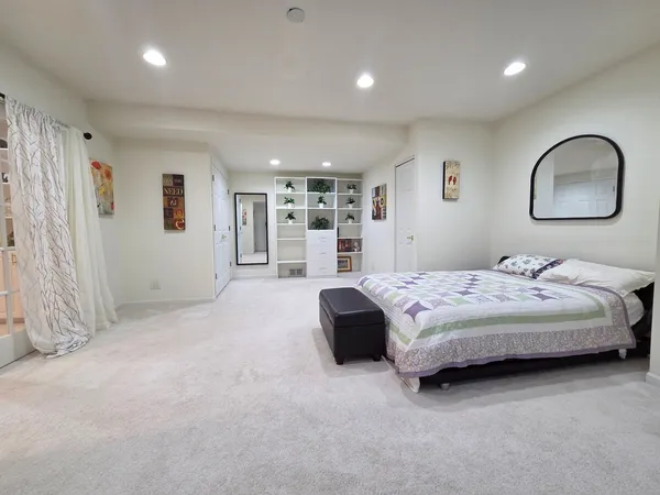 a bedroom with a bed and a cabinets