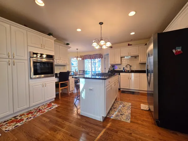 a large kitchen with lots of counter space and appliances