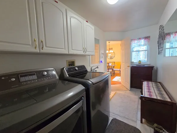 a kitchen that has a sink and a stove