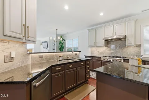 a view of dining room with wooden floor and cabinet