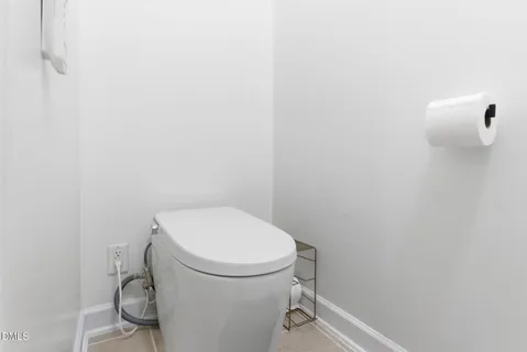 a view of backyard with a patio and a garden