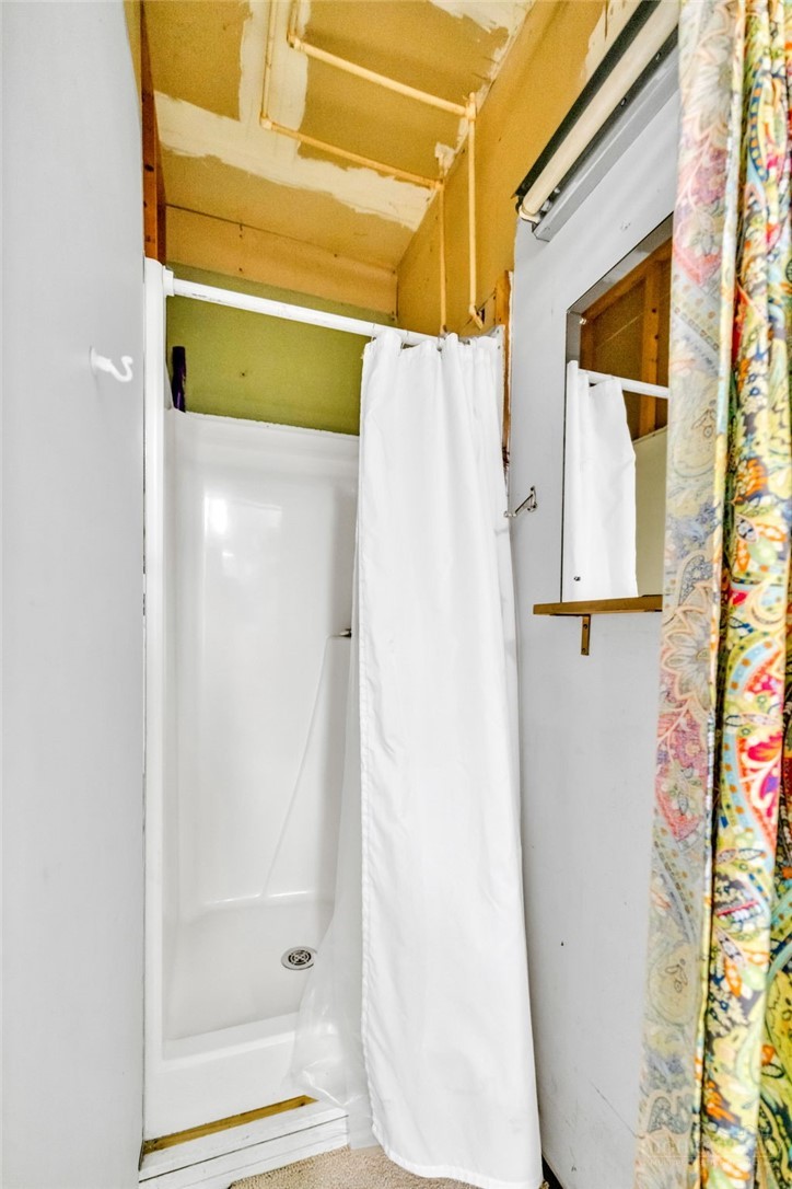 242 Ladd Parson Road Crumpler, NC 28617 - Photo 26 of 36 a bathroom with a shower and a sink
