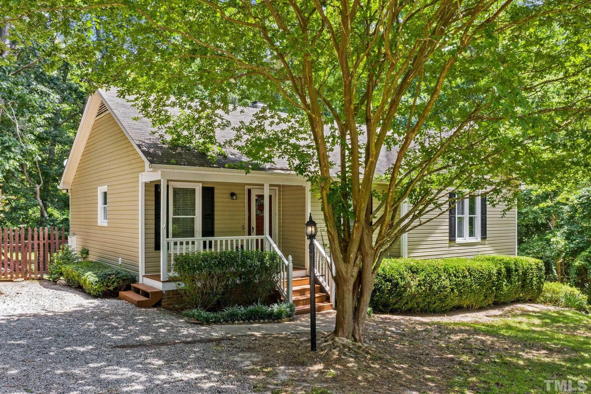 4209 Rockside Hills Drive Raleigh, NC 27603 - Photo 1 of 24 front view of a house with a yard