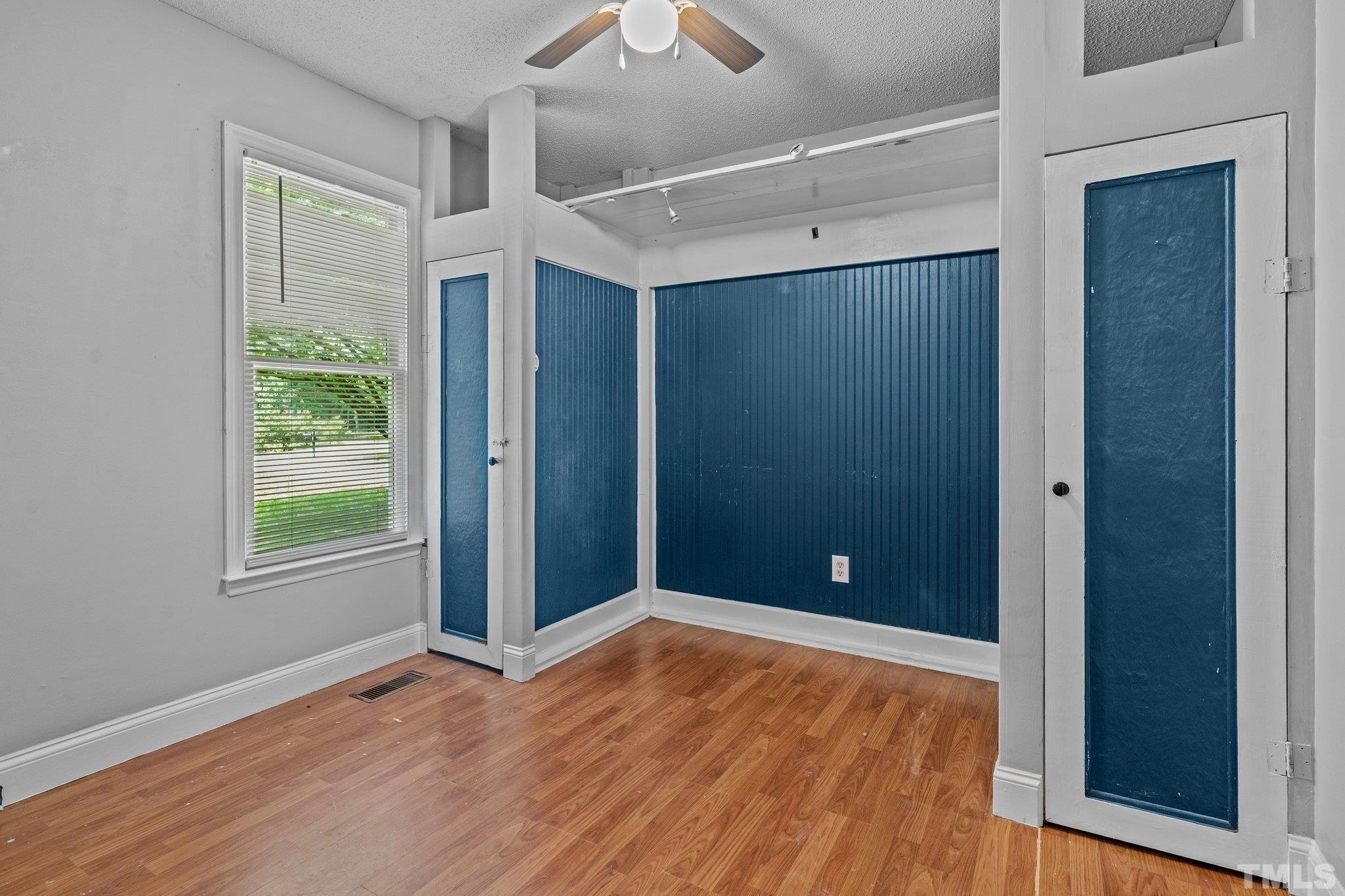 4209 Rockside Hills Drive Raleigh, NC 27603 - Photo 12 of 24 a view of empty room with wooden floor and fan