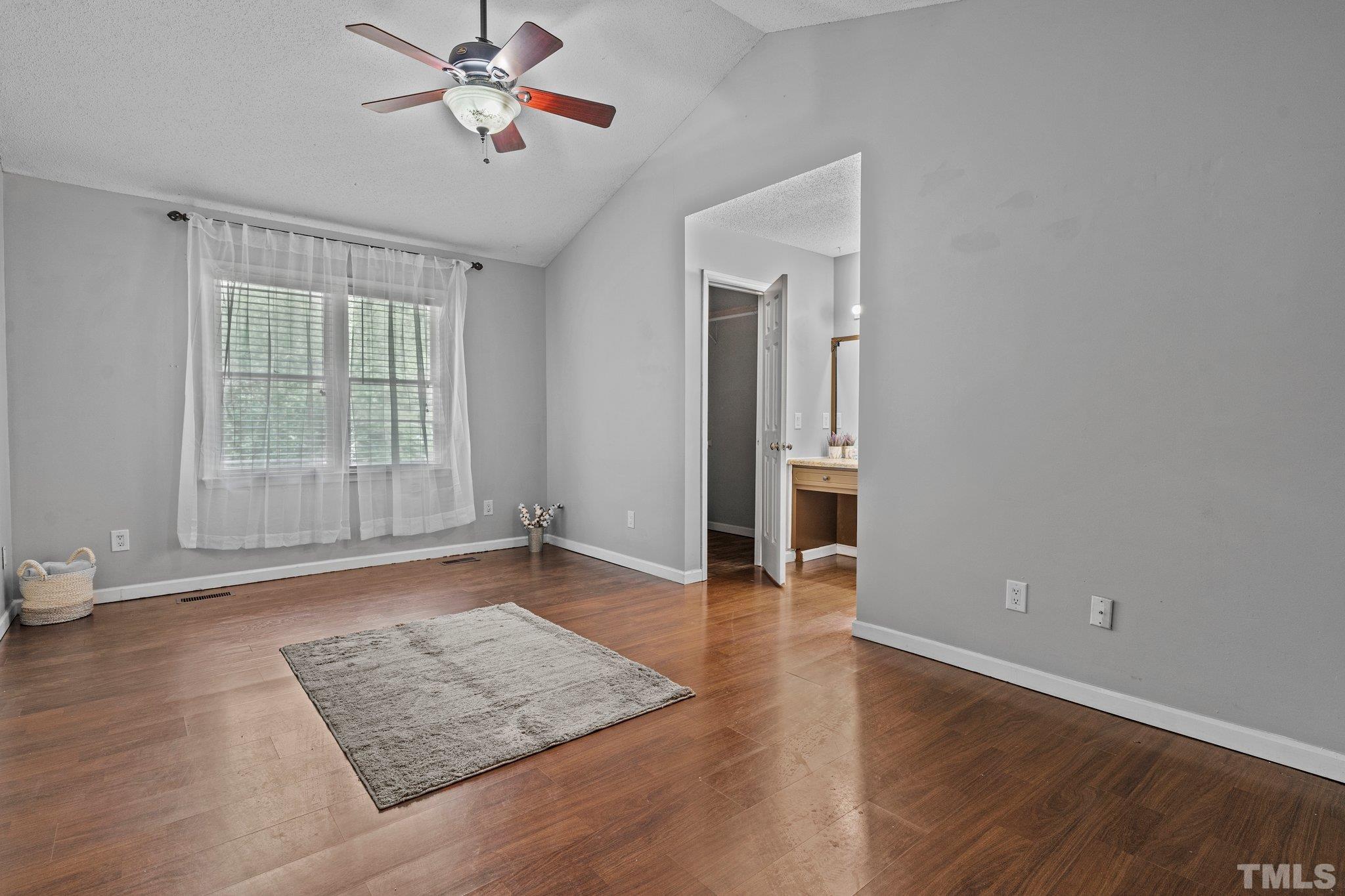 4209 Rockside Hills Drive Raleigh, NC 27603 - Photo 15 of 24 wooden floor in an empty room with a window