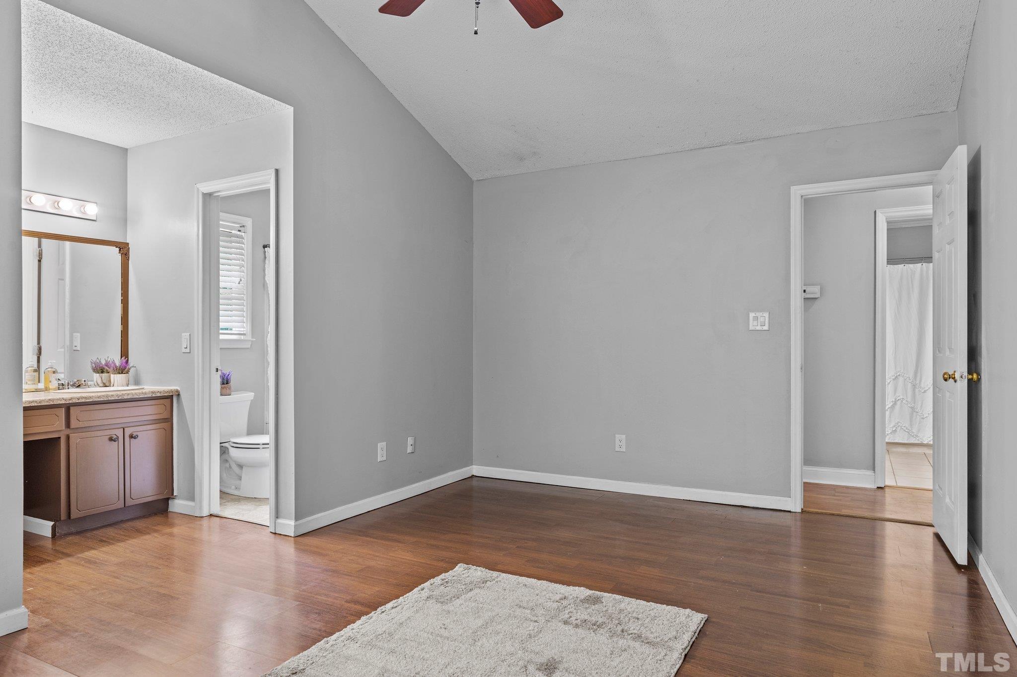 4209 Rockside Hills Drive Raleigh, NC 27603 - Photo 16 of 24 an empty room with wooden floor and windows