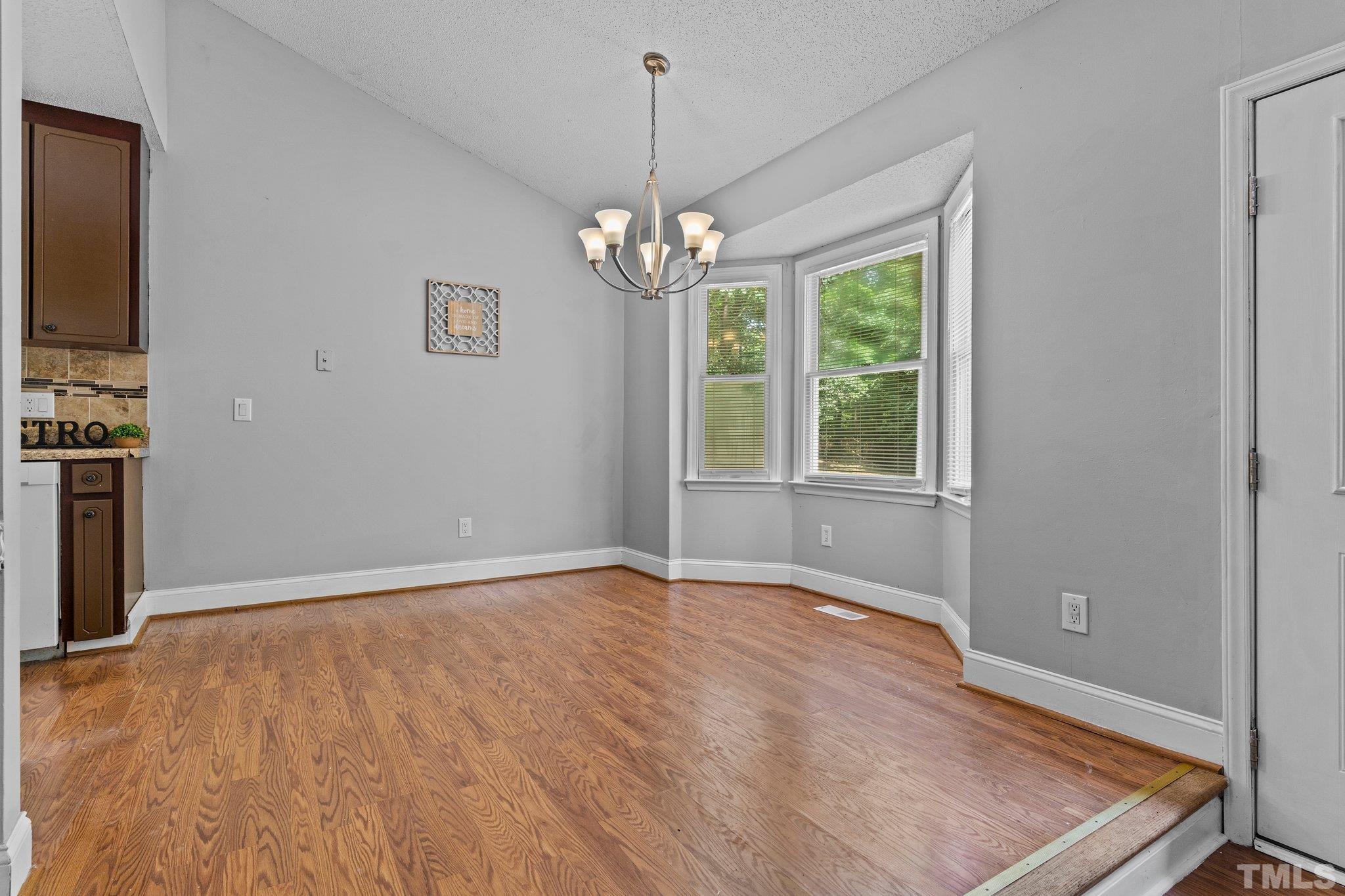 4209 Rockside Hills Drive Raleigh, NC 27603 - Photo 7 of 24 a view of an empty room with a window