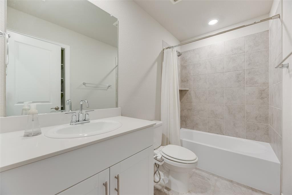 203 Rocky Road Melissa, TX 75454 - Photo 22 of 27 a bathroom with a sink toilet and shower