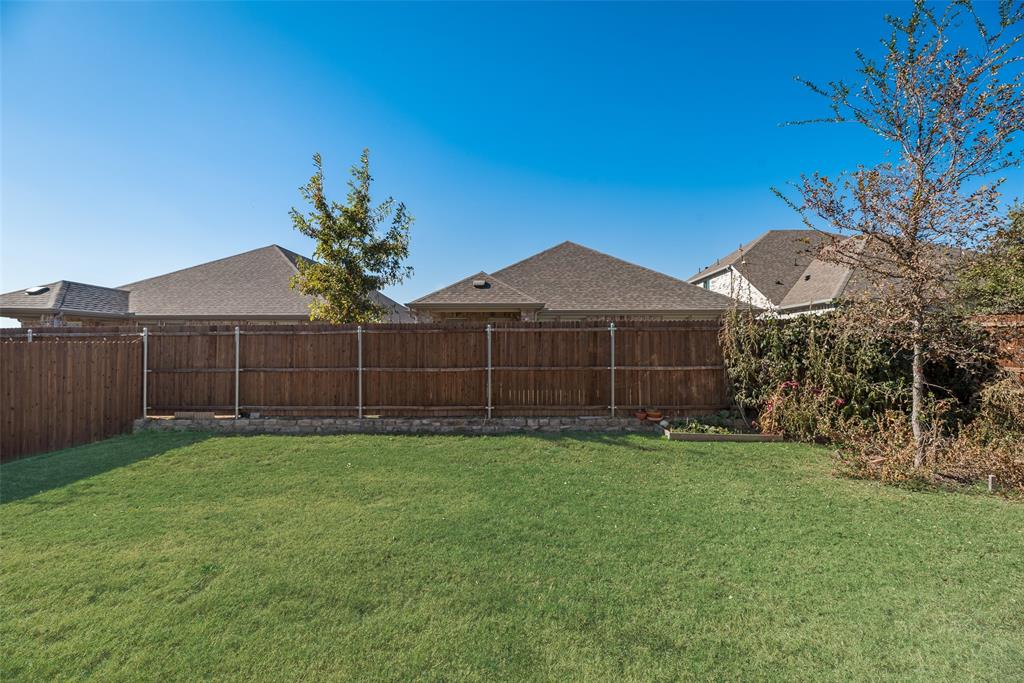203 Rocky Road Melissa, TX 75454 - Photo 26 of 27 a view of a back yard of the house