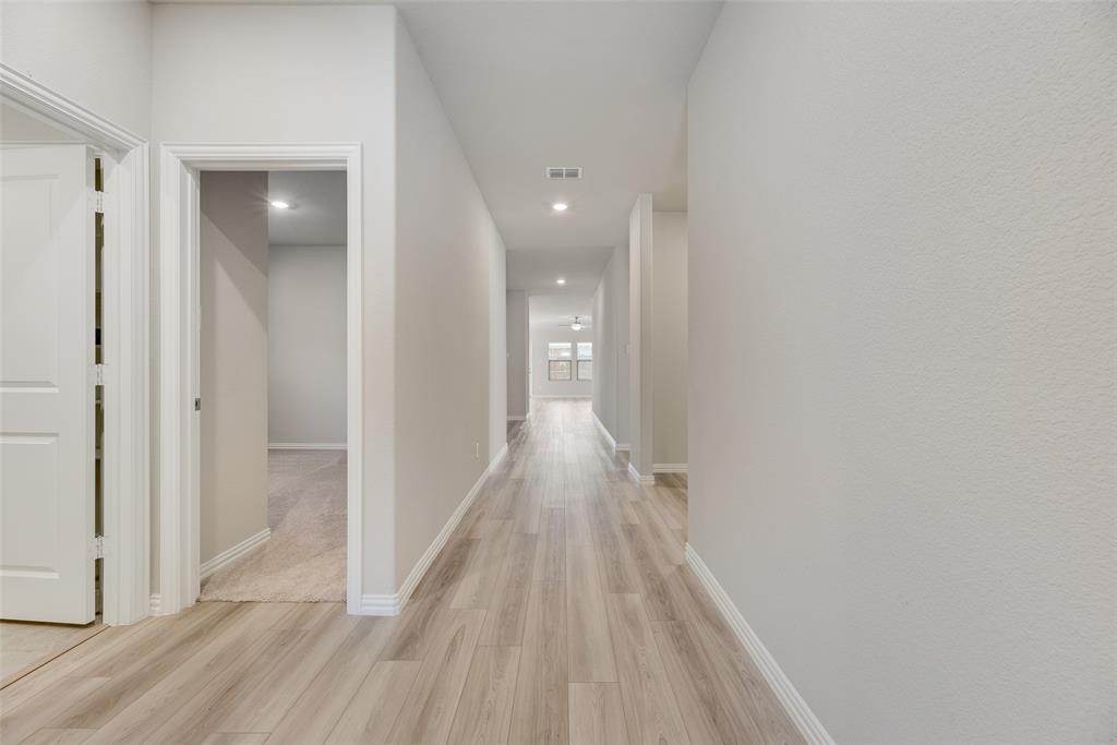 203 Rocky Road Melissa, TX 75454 - Photo 3 of 27 a view of hallway with wooden floor