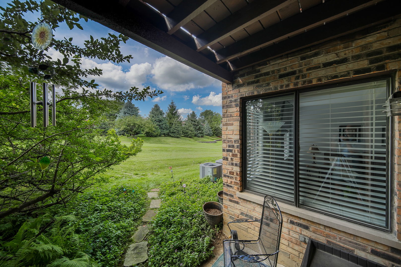 6230 Trinity Drive, Unit 1C Lisle, IL 60532 - Photo 15 of 27 a view of a backyard with sitting area