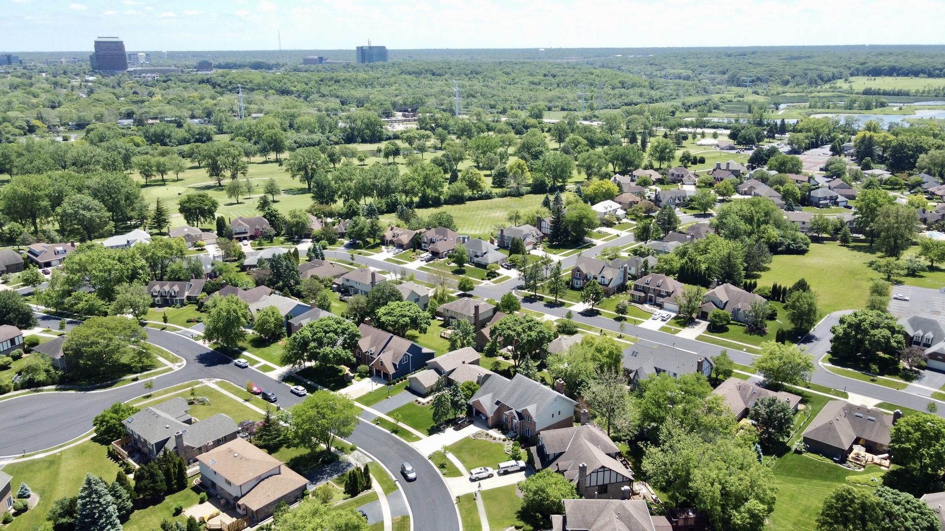 6230 Trinity Drive, Unit 1C Lisle, IL 60532 - Photo 26 of 27 an aerial view of a city with lots of residential buildings