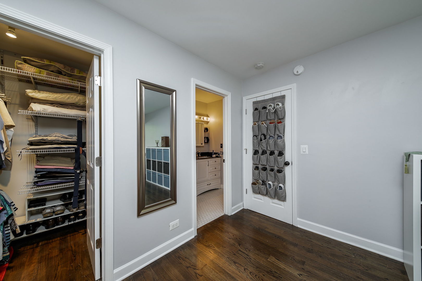 6230 Trinity Drive, Unit 1C Lisle, IL 60532 - Photo 9 of 27 a view of an empty room with wooden floor and a window