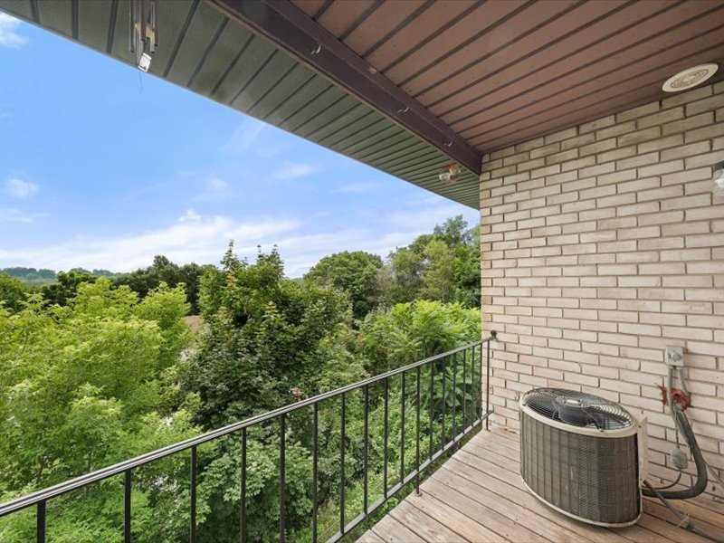 26 Cooper Road, Unit 306 Poughkeepsie, NY 12603 - Photo 14 of 16 a view of a balcony with wooden floor