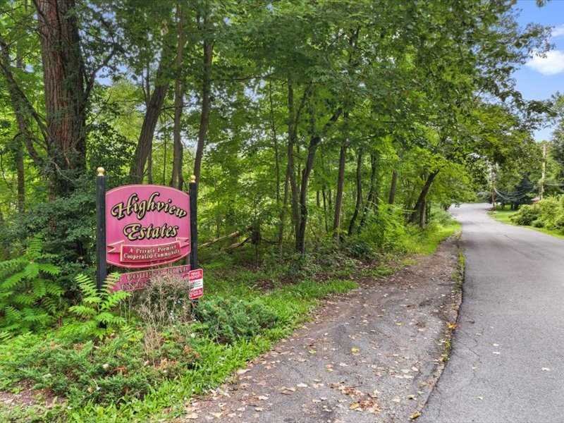 26 Cooper Road, Unit 306 Poughkeepsie, NY 12603 - Photo 16 of 16 a sign on the side of a road