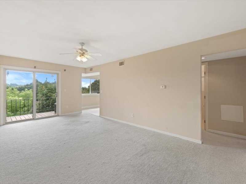 26 Cooper Road, Unit 306 Poughkeepsie, NY 12603 - Photo 3 of 16 a view of a livingroom with an empty space and a window