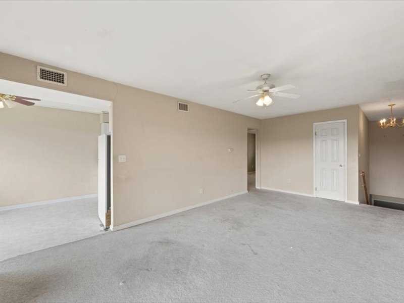 26 Cooper Road, Unit 306 Poughkeepsie, NY 12603 - Photo 4 of 16 a view of an empty room with a ceiling fan