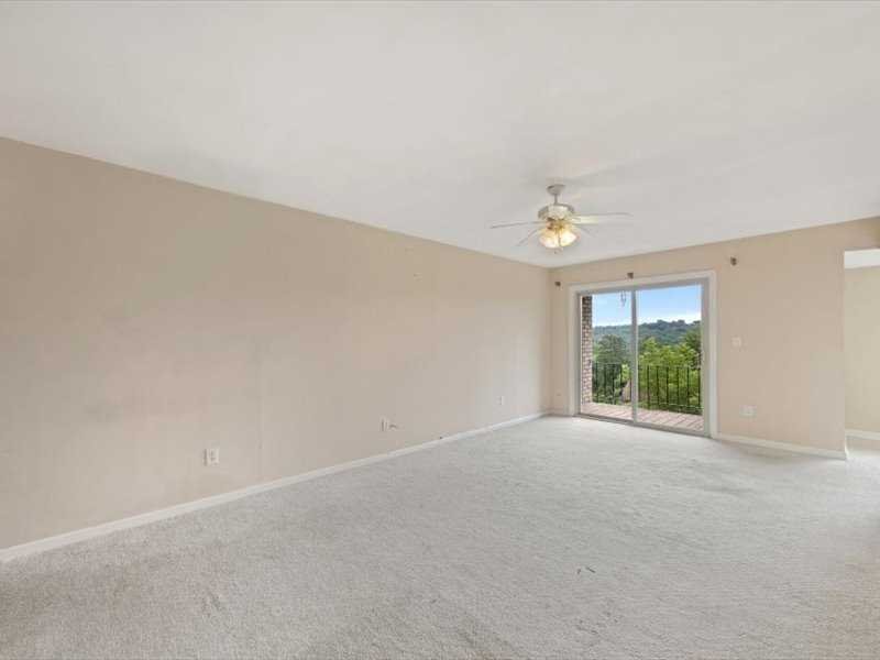 26 Cooper Road, Unit 306 Poughkeepsie, NY 12603 - Photo 5 of 16 a view of an empty room with a window