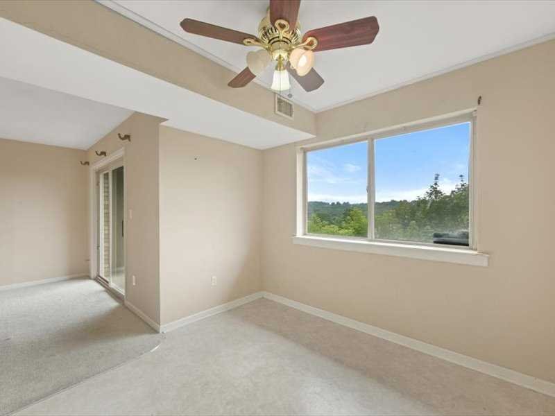26 Cooper Road, Unit 306 Poughkeepsie, NY 12603 - Photo 8 of 16 a view of an empty room with a window