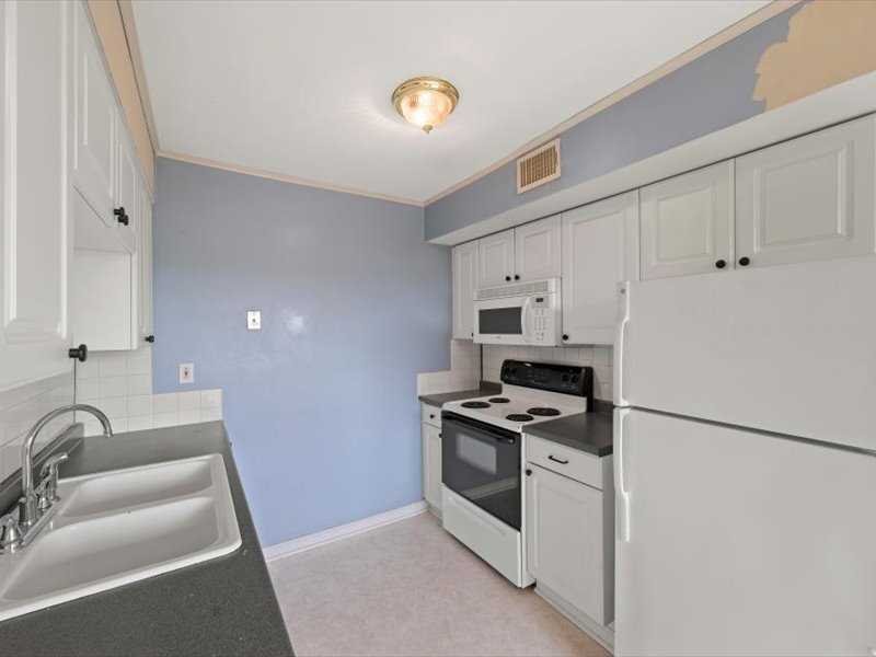 26 Cooper Road, Unit 306 Poughkeepsie, NY 12603 - Photo 10 of 16 a kitchen with stainless steel appliances granite countertop a sink stove and refrigerator