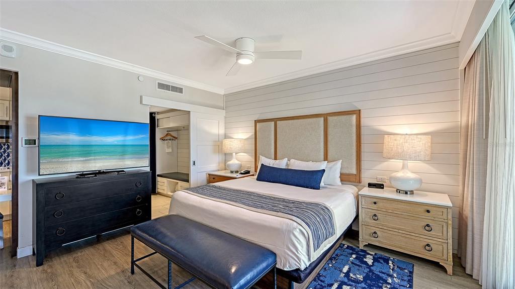 240 Sands Point Road, Unit 4206 Longboat Key, FL 34228 - Photo 14 of 41 a bedroom with a bed and a dresser