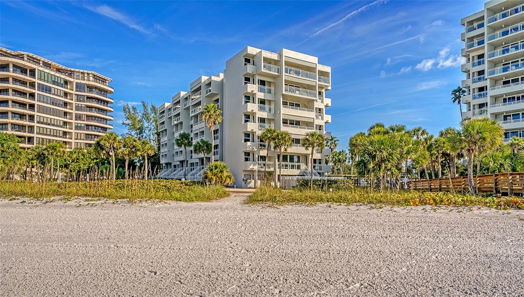 240 Sands Point Road, Unit 4206 Longboat Key, FL 34228 - Photo 27 of 41 a view of building with large trees