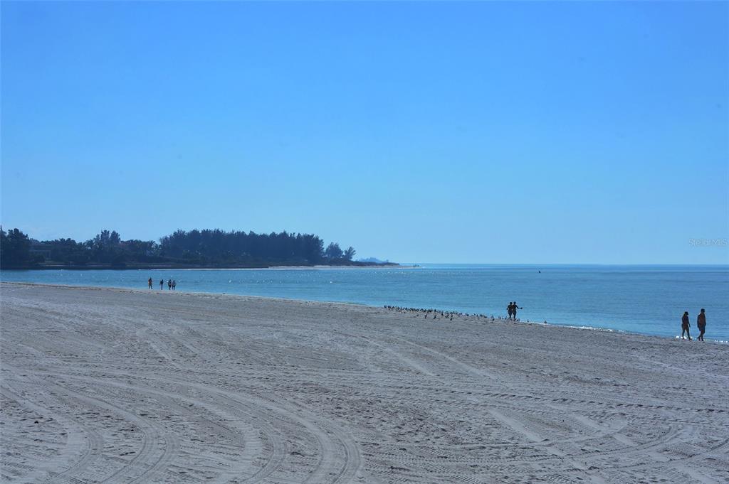 240 Sands Point Road, Unit 4206 Longboat Key, FL 34228 - Photo 32 of 41 a view of an ocean and beach