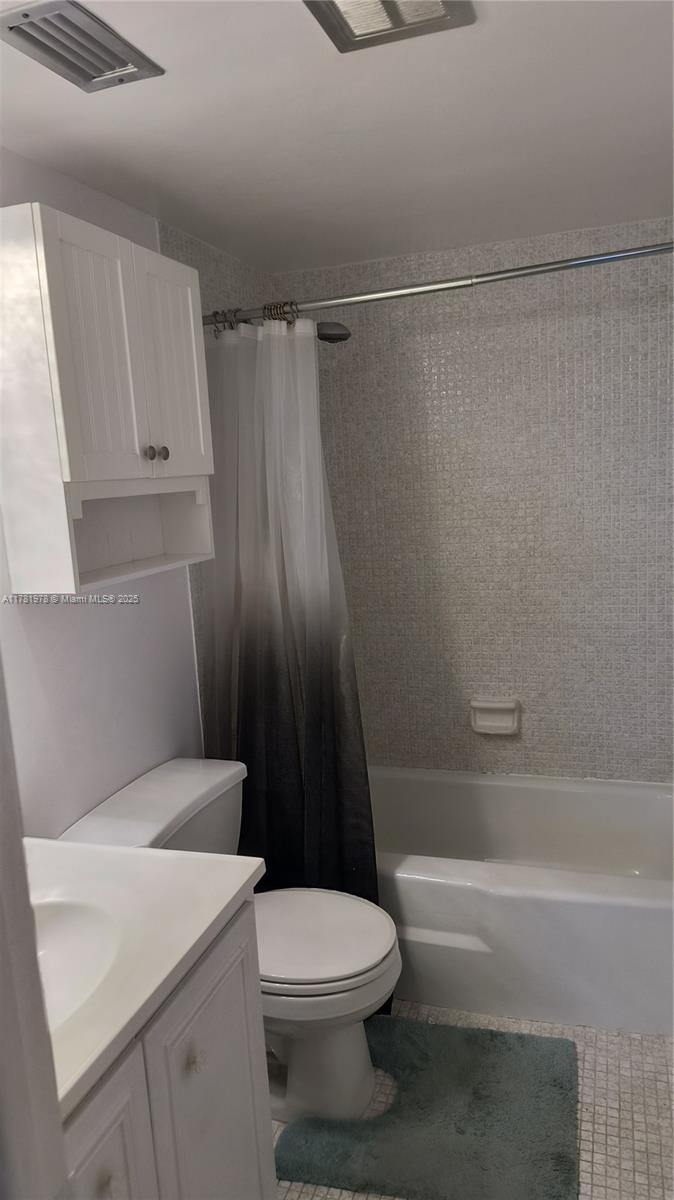 4500 North Federal Highway, Unit 352F Lighthouse Point, FL 33064 - Photo 12 of 32 a bathroom with a sink a toilet and shower