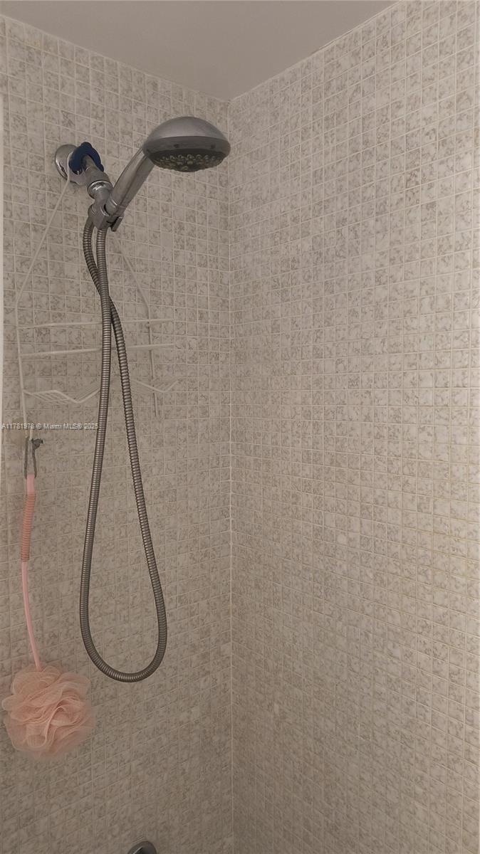 4500 North Federal Highway, Unit 352F Lighthouse Point, FL 33064 - Photo 13 of 32 a bathroom with a shower