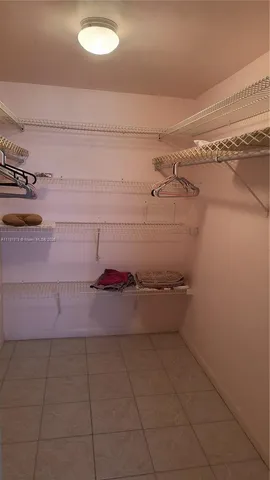 a view of palm trees in front of a building