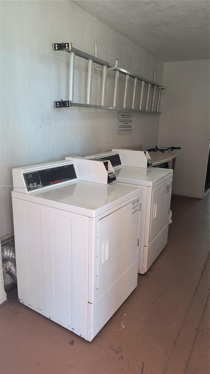 4500 North Federal Highway, Unit 352F Lighthouse Point, FL 33064 - Photo 24 of 32 a utility room with dryer and washer