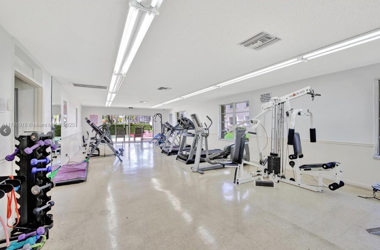 4500 North Federal Highway, Unit 352F Lighthouse Point, FL 33064 - Photo 26 of 32 a view of a room with gym equipment