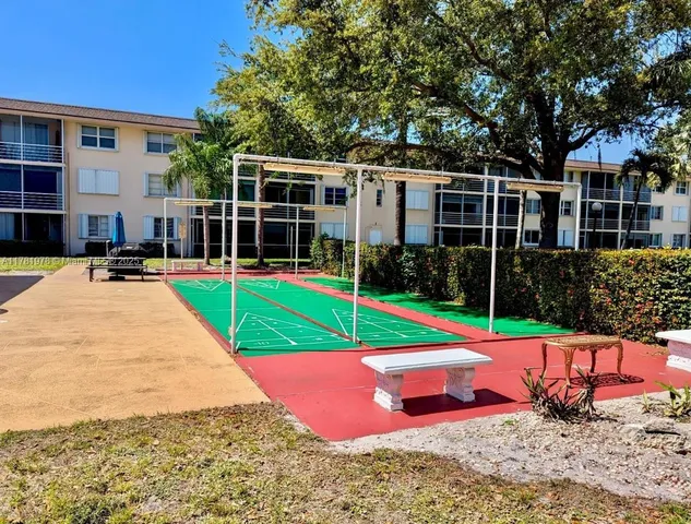 a view of a backyard with sitting area and slide
